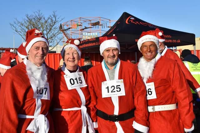 Competitors in the Santa Fun Run in Skegness. Photo Barry Robinson.