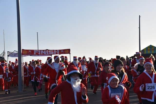 And they are off. Santas in the Fun Run in Skegness. Photo: Barry Robinson.