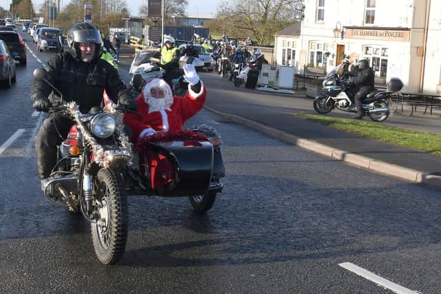 Motorbike group toy run from Hammer & Pincers, Boston. EMN-191216-142411005