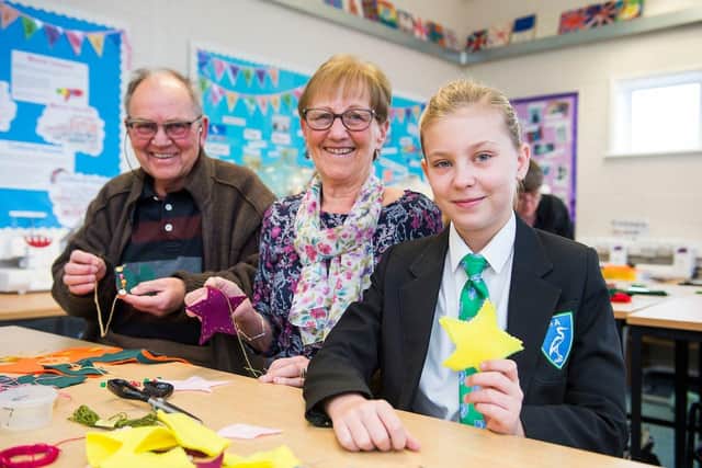 Somercotes Academy. Grandparents Day. Lorna Midgley and 'surrogate' grandparents (neighbours) Jane and Chris Flanagan in textiles. (Picture: Sean Spencer/Hull News & Pictures Ltd)