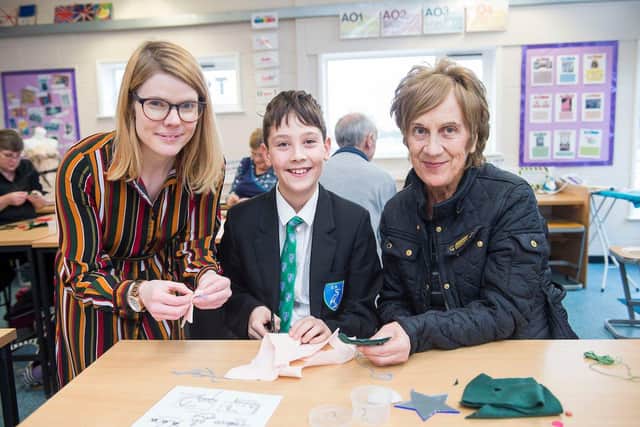 Somercotes Academy. Grandparents Day. Stella Munro and grandson George Seamons. Amelia Stephenson textiles teacher. “A few years since I have been in a classroom. Itâ€TMs a lovely idea to be here.†Making Xmas decorations in textiles. (Picture: Sean Spencer/Hull News & Pictures Ltd)