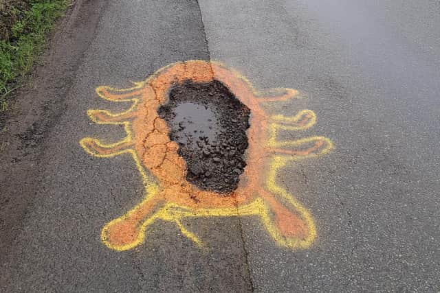 The pothole painted by 'Bugsy'.