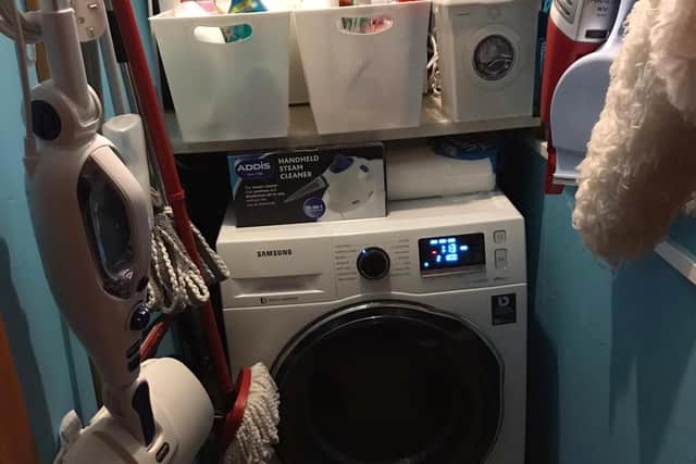BEFORE: The laundry cupboard after the tidy.