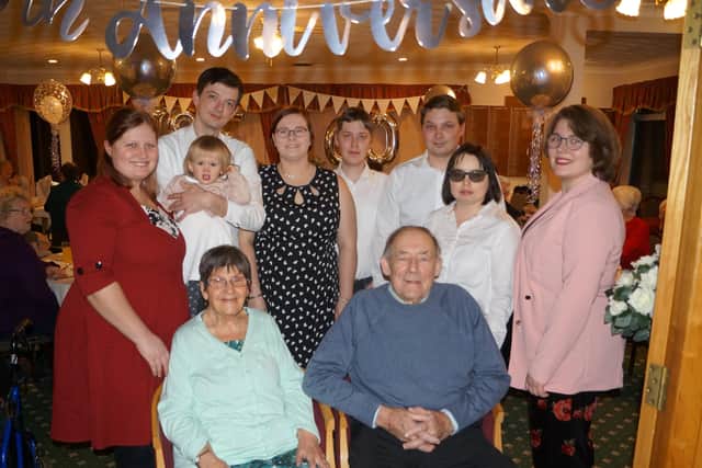 Grandchildren and their youngest great-grandchild helped the diamond couple celebrate  EMN-200128-070830001