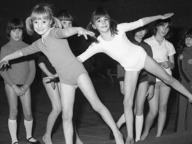Sisters Clare (eight) and Alison (six) Kelly, from Kirton, trying a spot of balancing on the beam.