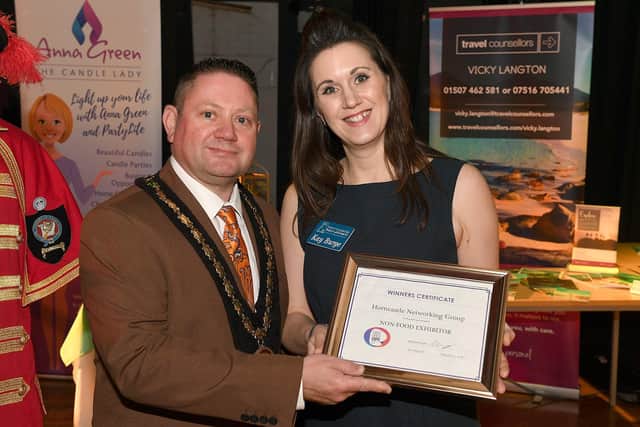 Expo Trade Show at Richmond Holiday Centre, Skegness. Winning Non-food exhibitor Kay Burge of Horncastle & District Networking Group, with Mayor of Skegness Mark Dannatt. ANL-200602-103943001