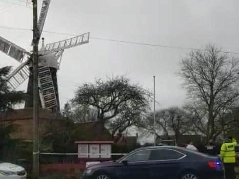 Police at the scene at Burgh Windmill over concerns regarding speed of sails during the storm.