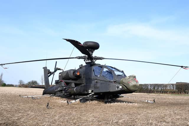 The helicopter was tethered down to weather the storm after it had to make a forced landed due to hydraulic issues. Photo: David Dawson