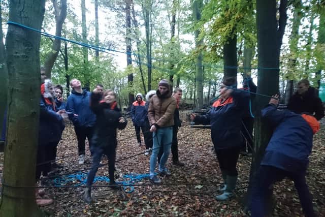 More challenges outdoors at a rope suspension exercise.