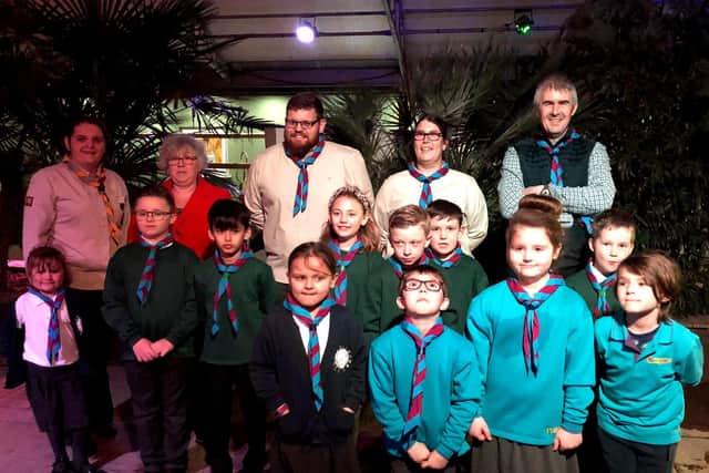 1st Wainfleet Scouts are invested at the Lincolnshire Wildlife Park. Also pictured are the adults - Adam Ongley, Emma Harness and Austen Ellis .