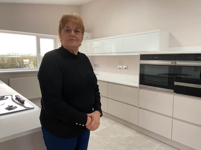 Jean Hart in her new kitchen. She says she is looking forward to  finally putting the memories  back into her home after the floods.