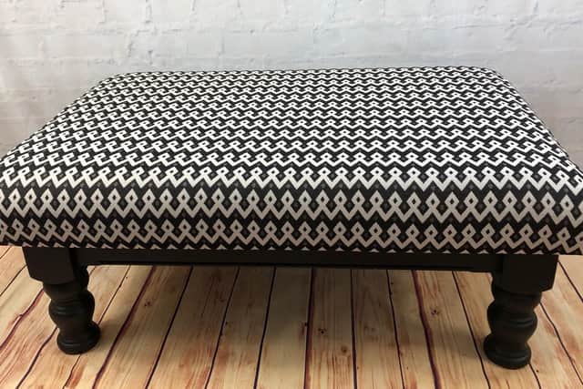 The former coffee table, now foot stool.