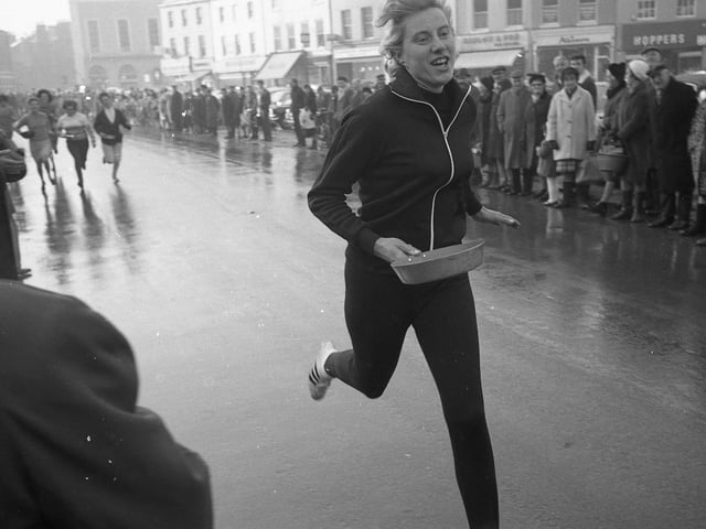 Boston swimmer June Holmes won the first heat in a time of 21.2 seconds.