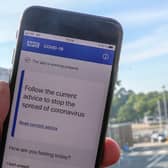 File photo of a person using the NHS coronavirus contact tracing app. The Department of Health and Social Care has said the Government will abandon its efforts to develop its own coronavirus contact-tracing app in order to focus on technology from Apple and Google. Photo: PA