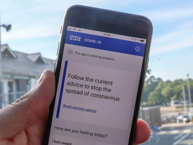 File photo of a person using the NHS coronavirus contact tracing app. The Department of Health and Social Care has said the Government will abandon its efforts to develop its own coronavirus contact-tracing app in order to focus on technology from Apple and Google. Photo: PA
