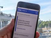 File photo of a person using the NHS coronavirus contact tracing app. The Department of Health and Social Care has said the Government will abandon its efforts to develop its own coronavirus contact-tracing app in order to focus on technology from Apple and Google. Photo: PA