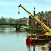 A crane manouvres onto a barge onto the River Ouse at Queens Staith in York in preparation for work on the Guildhall. Photo: Gary Longbottom