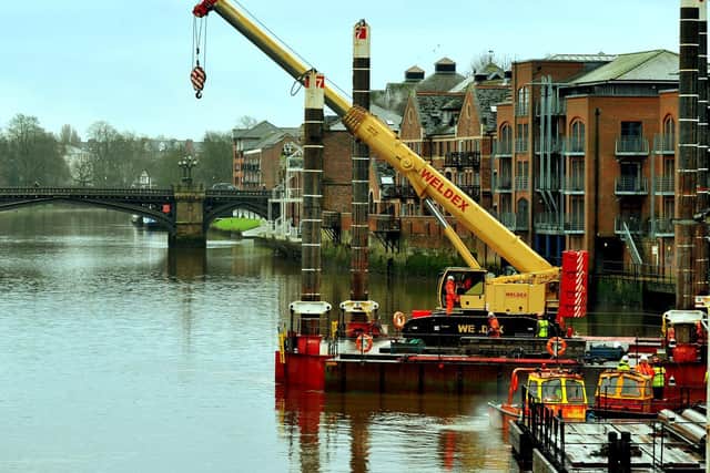 A crane manouvres onto a barge onto the River Ouse at Queens Staith in York in preparation for work on the Guildhall. Photo: Gary Longbottom