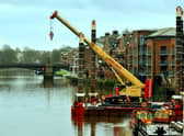 A crane manouvres onto a barge onto the River Ouse at Queens Staith in York in preparation for work on the Guildhall. Photo: Gary Longbottom