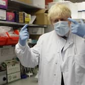 Prime Minister Boris Johnson gestures during a visit to the Jenner Institute in Oxford, where toured the laboratory and met scientists who are leading the COVID vaccine research. Photo: PA
