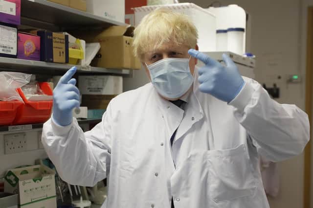 Prime Minister Boris Johnson gestures during a visit to the Jenner Institute in Oxford, where toured the laboratory and met scientists who are leading the COVID vaccine research. Photo: PA