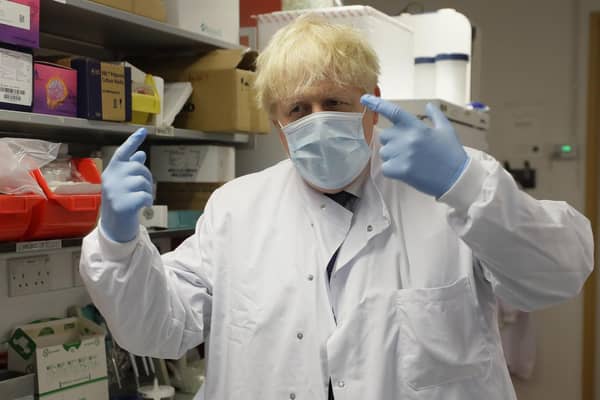 Prime Minister Boris Johnson gestures during a visit to the Jenner Institute in Oxford, where toured the laboratory and met scientists who are leading the COVID vaccine research. Photo: PA