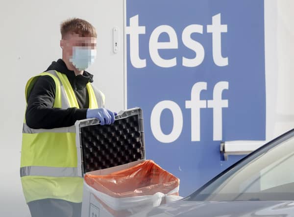 A worker at a Covid-19 driving in testing centre at Temple Green Park and Ride in Leeds, West Yorkshire. Photo: PA