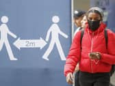 A social distancing sign in Leeds city centre, West Yorkshire, where tougher lockdown measures will be introduced locally after a rise in coronavirus infections. Photo: PA