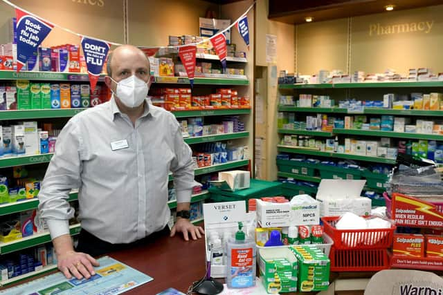 Pharmacist Daniel Brash checking their supply of flu vaccines at Mitchell's Chemist in Horsforth, Leeds. Photo: Gary Longbottom