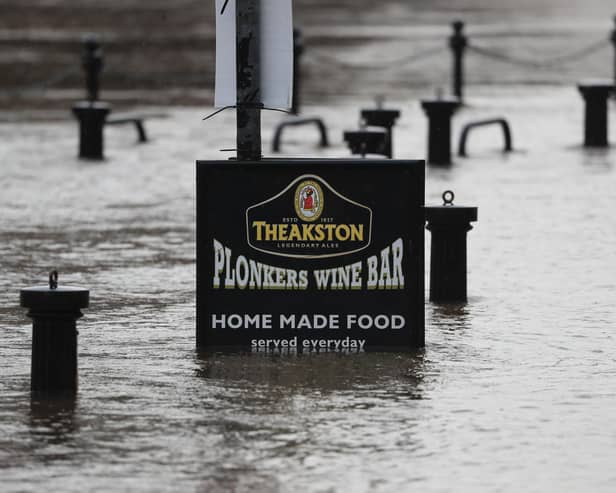 Flood water rises up a sign outside a pub in York as Storm Christoph is set to bring widespread flooding, gales and snow to parts of the UK. Photo: PA