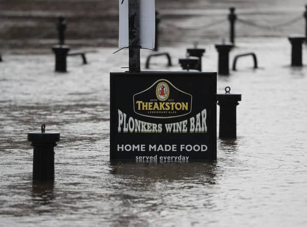 Flood water rises up a sign outside a pub in York as Storm Christoph is set to bring widespread flooding, gales and snow to parts of the UK. Photo: PA