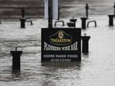 Flood water rises up a sign outside a pub in York as Storm Christoph is set to bring widespread flooding, gales and snow to parts of the UK. Photo: PA
