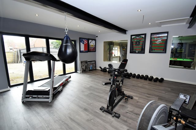 Formed within garage space is the property's home gym