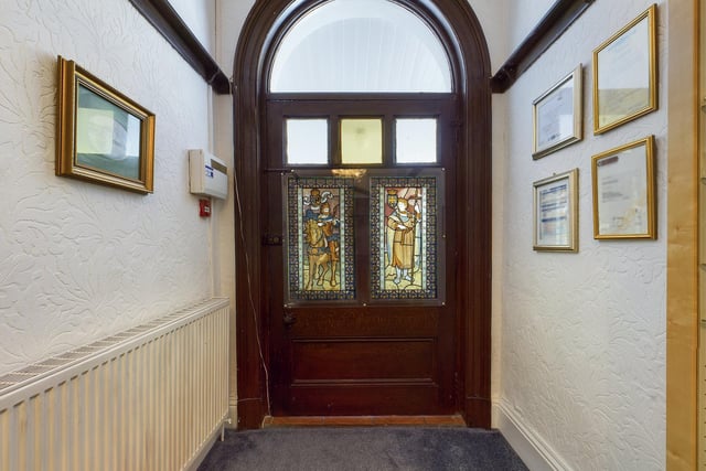 The oak entrance door and dado rail were originally from the vestry at St. Anne's R.C. Cathedral in Leeds.