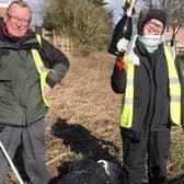 Just before lock down, volunteers did a couple of litter picks along the lane next to the police station. Litter pickers Scotney and Randolph Murray are pictured with their grabbers and bags. EMN-200607-121230001