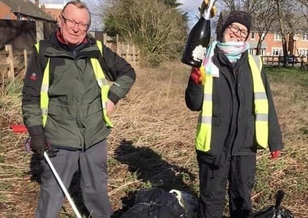 Just before lock down, volunteers did a couple of litter picks along the lane next to the police station. Litter pickers Scotney and Randolph Murray are pictured with their grabbers and bags. EMN-200607-121230001