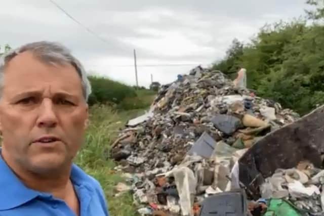 Leadenham farmer Andrew Ward, calling for action from his MP and government after three lorry loads of waste were dumped on a farm track. EMN-200607-152724001