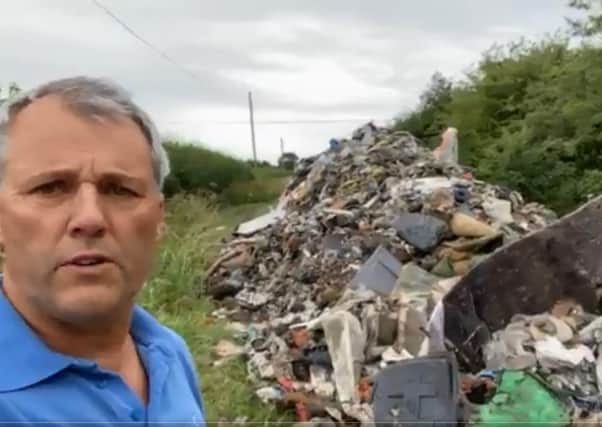 Leadenham farmer Andrew Ward, calling for action from his MP and government after three lorry loads of waste were dumped on a farm track. EMN-200607-152724001