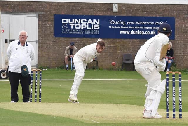 Woodhall Spa's Joe Irving sends down a delivery at Sleaford last year. Photo: David Dawson