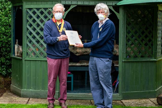 Outgoing president Jo Bowman was presented with his ‘cuttings’ file