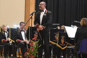 A previous year's Royal British Legion poppy prom with Sleaford Concert Band Director of Music Richard Joyce . EMN-200307-122652001