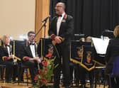 A previous year's Royal British Legion poppy prom with Sleaford Concert Band Director of Music Richard Joyce . EMN-200307-122652001