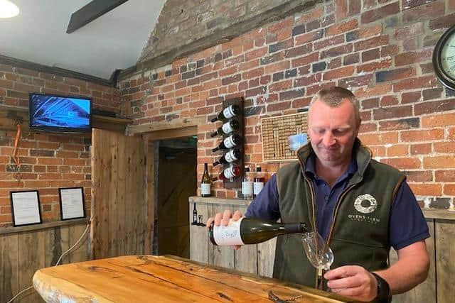 Simon White pouring a glass of wine in the tasting room. For the time being group tastings have been put on hold.