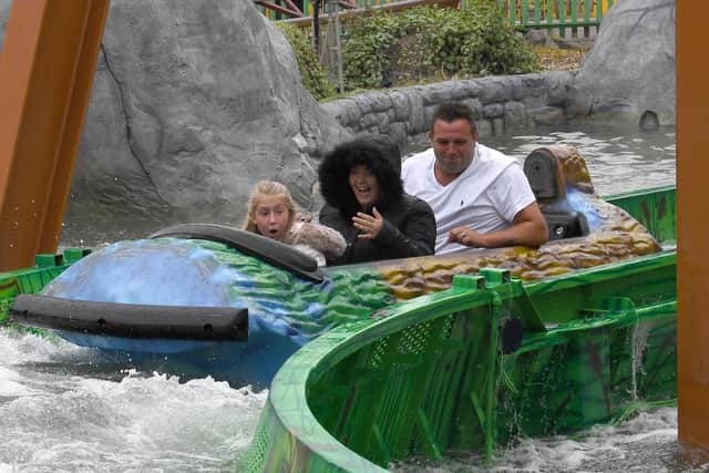 Making a splash are John and Clare Brown of Northampton, with Natasha, 9.