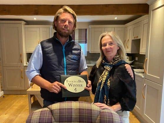 Mother and son Karen and Liam Cumberlidge, who own the Jockhedge Holiday Cottages, Farmhouse and Touring Site in Burgh le Marsh, with their award for winning Channel 4's Four in a Bed.
