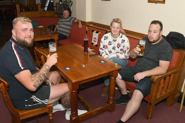 Billy Stone, Chloe Sippits and  Jordon Doughty of Skegness enjoying a pint at the Highwayman.