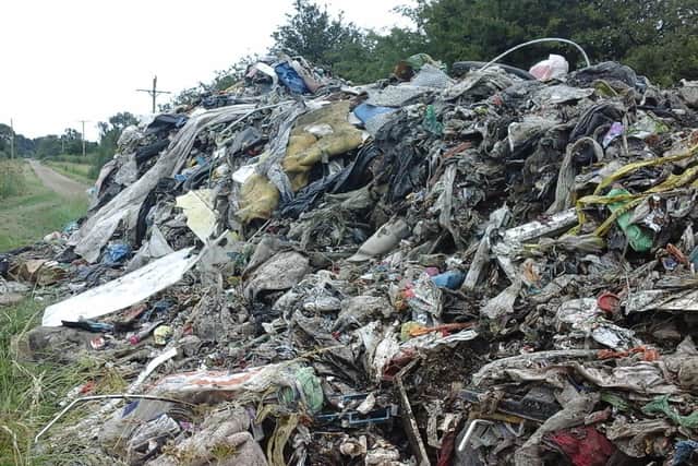 A huge heap of waste dumped by fly tippers on a track near Fulbeck. EMN-200707-180147001