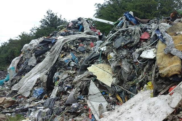 All manner of rubbish can be seen in the pile the size of a Transit van. EMN-200707-180200001