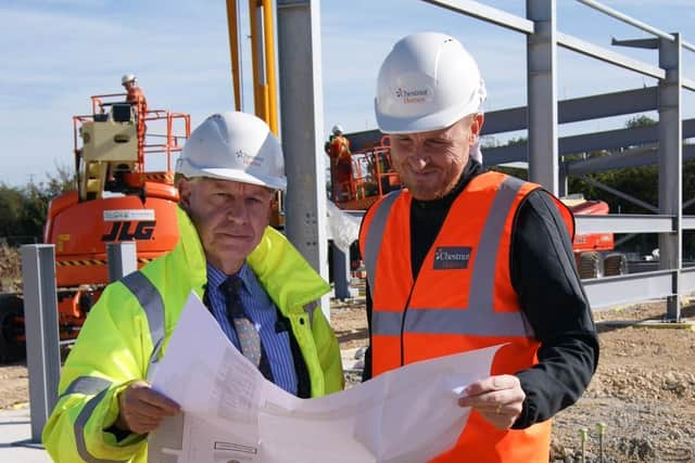 Newton (left) and manager Craig Elliott on a previous site visit.