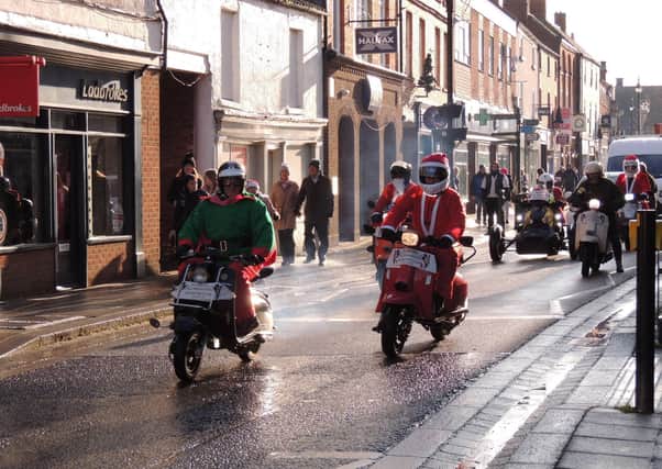 Sleaford Christmas Market will go online and in newsletter form this year due to Covid-19 concerns and the Sleaford All-Knighters Happy Chappy Scooter Run will also be postponed. The scooters are pictured at the launch of last year's Christmas Market. EMN-201007-112717001